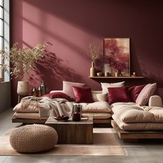 a living room with red walls and furniture