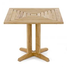 a wooden table with an intricate design on it's top and legs, against a white background