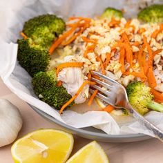 a close up of a plate of food with broccoli, carrots and chicken