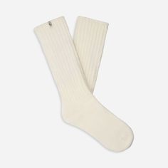 Made from a soft rib knit and crafted with Responsible Cotton, the Tyla Slouchy Crew sock is designed for a slouchier fit. | Slouchy Cotton sock. 97% Cotton/2% Recycled Polyester/1% Elastane. Made from Responsible Cotton. 11 inch height. Soft twill tape with The UGG® Logo on top cuff. Fits shoe size: 5-10. Imported. | UGG® Women's Tyla Slouchy Crew Sock Cotton Blend Socks in Nimbus