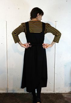 "This pinafore/dugaree has been crafted from a soft vintage fabric, a Milan-stich fabric, a soft middle weight cotton jersey that has a comfortable fit. It has two decorative vintage bakelite buttons on the shoulders. This classical and comfy fit dress is ideal to go with any top (shirt, blouse, long sleeve or 3/4 length). ▲ ▼ CUSTOMIZE your dress: write to me to have modification/alteration (length, etc..) and I will get back to you to do my best and give you your personalized dress ▲ ▼ *Actual Black Daywear Dress With Slip Pockets, Black Sleeveless Pinafore Dress For Fall, Black Pinafore, Bakelite Buttons, Blouse Long Sleeve, Vintage Bakelite, Fabric Black, Pinafore Dress, Fit Dress