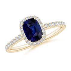 a blue sapphire and diamond ring in yellow gold