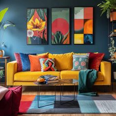 a living room filled with furniture and paintings on the wall above it's coffee table