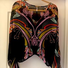 Gorgeous Free People Blouse With Gathered Waistline And Full Dolman Sleeves. V Neck. Never Worn. Black V-neck Top For Beach, Black V-neck Printed Blouse, Black V-neck Blouse For Beach, Chic Multicolor Viscose Blouse, Bohemian V-neck Top For Night Out, Casual Tops With Vibrant Print For Party, Black Bohemian Printed Blouse, Black Floral Print Party Tops, Chic Patterned V-neck Top