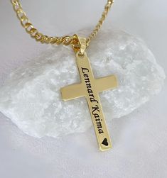 Our engraved gold Crosses are available with a range of chain lengths and different style. Our Gold Crosses have won praise from customers around the world. Check out our customer reviews. ITEM DETAILS: - 14 k gold over Sterling silver Cross. - 14 k gold filled and gold over sterling silver chains to be chosen from drop down menu. Need charms? http://etsy.me/1Njb7NM Classic Crosses  http://etsy.me/1JZ3tah Celtic Crosses  http://etsy.me/1Le9a5C Browse shop: https://www.MCACrossesJewelry.etsy.com It will be sent in a small gift box, silver or white. Chain drop down: Top chain Gold filled rolo    Middle chain Gold filled cable   Bottom chain Gold filled rope    Thank you very much for visiting our store. Cross-shaped Name Jewelry For Anniversary, Name-engraved Cross Jewelry For Anniversary, Anniversary Jewelry With Name And Cross Shape, Cross Pendant Jewelry With Name For Gift, Name Engraved Cross Pendant Jewelry For Gift, Name-engraved Cross Pendant Jewelry Gift, Name Engraved Cross Pendant Jewelry Gift, Name Necklace With Cross Pendant For Gift, Personalized Cross Pendant Jewelry Gift