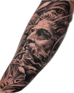 a man's arm with a black and grey tattoo on it, depicting the face of an ancient greek god