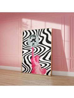 a pink and black room with a zebra print wall hanging on the wall next to it