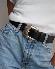 Handcrafted in Italy⁣ Genuine full-grained Italian leather⁣ Velvety Nubuck leather lining⁣ Statement silver tone brushed satin finish buckle Adjustment: 5 holes⁣ Strap Width: 1.5" (4 cm) ⁣ Sizing: Measurement is taken from the buckle point to the center hole⁣XXS: 27”⁣ (jean size 22-24)XS/S: 31”⁣ (jean size 25-27)M/L: 35”⁣ (jean size 28-30) Everyday Black Leather Belt Buckle, Casual Black Belt With Buckle Closure, Timeless Black Leather Belt Buckles, Black Belt With Buckle Closure, Black Leather Belt Silver Buckle, Silver Belts, Leather Silver, Nubuck Leather, Black Belt