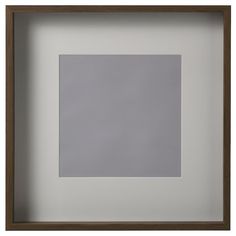 an empty square in a wooden frame on a white wall with a gray flooring area