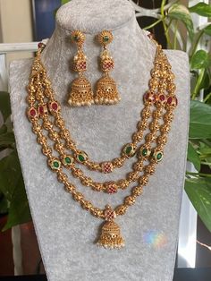 "24 K gold plated beaded long necklace with matching delicate earrings Three Layer Short Mala/ Indian Necklace/ Indian Long Necklace/ Long Gold Necklace/ Indian Jewelry/ Indian Necklace/ Punjabi Jewelry Highest quality and craftsmanship Indian Bridal Traditional One Gram Jewelry Necklace Set. Length : 16 \" All the raw material used in this product is of high quality and is handcrafted with love. Premium Quality and High craftsmanship 100% Satisfaction Guarantee: Long Lasting Plating, High-Quali 3 Layer Chain Necklace Gold Indian, Long Gold Earrings Indian Jewelry, 3 Layer Necklace Gold Indian, Three Layer Necklace Gold Indian, Gold Layer Necklace, Layer Chain Gold Indian, Gold Balls Chain Indian, Mala Set In Gold, Balls Chains In Gold