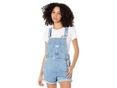 Levi's(r) Womens Vintage Shortall - Women's Jumpsuit & Rompers One Piece : Mini Indigo : Give your look a vintage feel with this Levi's Womens shortall. Relaxed-fit overalls boast tacked cuffs. Adjustable shoulder straps attach at the bib. Single pocket at bib. Front hand pockets. Back patch pockets boast signature arcuate stitch and red tab detail. Triple button closure at sides. 65% cotton, 35% lyocell. Machine wash and tumble dry. Imported. Measurements: Inseam: 5 1 2 in Product measureme Medium Wash Cotton Shortalls With Adjustable Straps, Cotton Relaxed Fit Shortalls With Adjustable Straps, Cotton Shortalls With Adjustable Straps And Relaxed Fit, Medium Wash Overall Shortalls With Suspenders, Medium Wash Shortalls With Suspenders, Utility Style Shortalls With Pockets And Relaxed Fit, Utility Style Relaxed Fit Shortalls With Pockets, Relaxed Fit Utility Shortalls With Pockets, Medium Wash Shortalls With Adjustable Straps