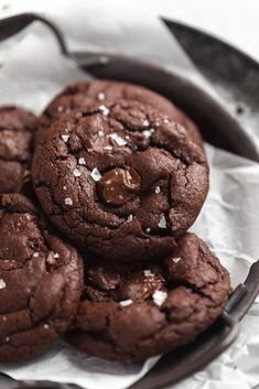 chocolate cookies with sea salt on top in a frying pan, ready to be eaten