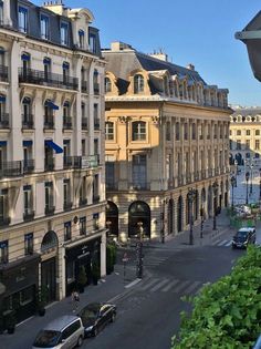 a city street with cars parked on both sides