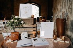 the table is set up with books, photos and other items for guests to take pictures