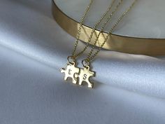 "This tiny puzzle piece pendant is personalized with your lowercase letter choice and paired with a beautiful chain. Get a bunch as perfect gifts for a friend group or family! Available in your choice of silver, gold, or our new rose gold options. Easily mix and match metal colors for large orders by specifying the letter and necklace color in the Note to Seller section at checkout. The necklace is adjustable from 16\" - 18\" inches. ⋯ P E R F E C T F O R ⋯ ♡ Valentine's Day Gift ♡ Galentine's D Long Distance Jewelry, Long Distance Necklace, Gifts For A Friend, Puzzle Piece Necklace, Long Distance Relationship Gifts, Bff Gift, Necklace Mom, Friend Jewelry, Best Friend Jewelry