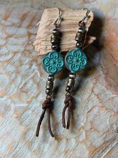 Beautiful Turquoise metal bead with bronze, leather and silver embellishments. Fun to wear and lightweight! Adjustable Bohemian Patina Earrings, Bohemian Turquoise Hand-tooled Earrings, Blue Bohemian Hand-tooled Earrings, Bohemian Turquoise Concho Earrings, Adjustable Turquoise Beaded Copper Earrings, Bohemian Concho Earrings For Festival, Adjustable Turquoise Concho Earrings, Pom Crafts, Leather Jewelry Making