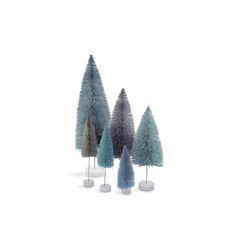 three small trees are standing next to each other