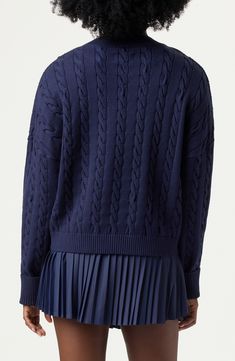 This chunky cable-stitch sweater is a lightweight layering piece that evokes a classic tennis look. 21 1/2" length V-neck Long sleeves Dropped shoulders Ribbed cuffs and hem 72% viscose, 28% polyester Machine wash, tumble dry Imported Cable Stitch, French Navy, V Neck Sweater, Layering Pieces, Vneck Sweater, Drop Shoulder, Top Brands, Layering, Tennis