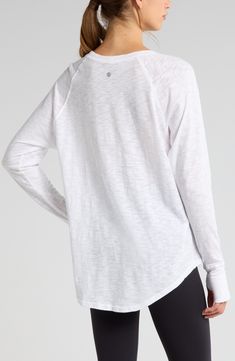 Work out or chill out in this breathable cotton top designed with sporty raglan sleeves and thumbhole cuffs. 29" length (size Medium) Crewneck Long sleeves with thumbhole cuffs 100% cotton Machine wash, tumble dry Imported White Raglan Sleeve Tops For Athleisure, White Breathable Long Sleeve Activewear, White Breathable Athleisure T-shirt, White Long Sleeve Athleisure T-shirt, Sporty White Breathable T-shirt, Cotton Tops Designs, Cotton Top, Free Fabric, Fabric Gifts