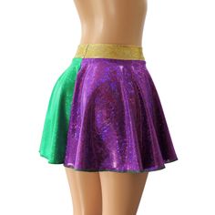 "Green and Purple Holographic Spandex Circle Skirt with a 2\" Hologram Wasitband. You are sure to be sparking at your next event in this sassy little skirt! WAISTBAND OPTIONS 1. GREEN HOLOGRAM 2. PURPLE HOLOGRAM 3. GOLD HOLOGRAM SKIRT LENGTHS Skirt Lengths: Front/Back Toddler 2/37\"/8\" Child X-Small 10\" / 11\" Child Small12\"/13\" Child 6X-711\"/12\" Child Medium13\"/14\" Child Large13\"/14\" Adult XS 13\"/14\" Adult Small 14.5\" / 16\" Adult Medium14.5\"/16\" Adult Large15\"/17\" Adult X-Larg Stretch Skirt For Cheerleading, Fitted Party Skirt With Elastic Waistband, Fitted Skirt With Elastic Waistband For Party, Green Stretch Skort For Party, Stretch Mini Skort For Dance, Stretch Mini Skirt For Costume Party, Stretch Lined Mini Skirt For Cheerleading, Fitted Green Bottoms For Dance, Fitted Party Skort With Elastic Waistband