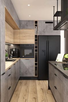 a modern kitchen with wood flooring and black appliances in the center, along with an open shelving unit