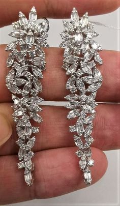 LAST CALL, LAST CHANCE LIQUIDATION SALE The Following Items we are offering is a Rare Important Spectacular and Brilliant 18KT Gold Large Gorgeous Fancy Cascading Diamond Drop Draping Earrings. Earrings consists of Rare Fine Magnificent Fancy Glittering Diamonds. T.C.W. with approx 3.75CTS of Fancy Baguette and Trillion Cut Diamonds These Magnificent Earrings are a Rare Sample Pair and from a Private Manufacturer that sold to Important 5 Star Hotel and Fine Jewelry Stores and come NWT $18,559 and with a Gemological Certificate! A Pair of Exquisite Masterpieces!! We are in the Process of Liquidation and selling at BELOW DEALERS COST in order to stay in business WE PACK, SHIP, AND INSURE WORLDWIDE COME VISIT US AT:   ROYALE GALLERIES INC. 318 EAST 59TH STREET NEW YORK, NY 10022 212-308-0200 Mint Green Earrings, Rare Jewelry, 5 Star Hotel, Liquidation Sale, Greek Jewelry, Link Earrings, Party Earrings, Birthday Gifts For Girlfriend, Star Hotel