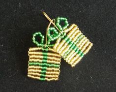 two small green and yellow pins sitting next to each other on a black table top