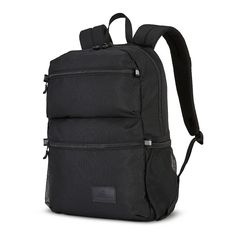 a black backpack with zippers on the front and side pockets, sitting against a white background