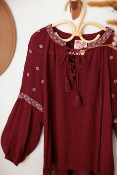 ♡ Look effortlessly stylish in our Ethnic Boho Embroidered Front Tie Girls Top. With its unique embroidered detailing and trendy front tie, this top will elevate your outfit to the next level. Designed for comfort with long sleeves, it's perfect for any occasion. Embrace your boho side and stand out from the crowd! ♡ Item Feature: ethnic boho, embroidered, front tie, long sleeve, light weight, beaded, festival, chic, stylish. Bohemian Cotton Blouse With Back Tassel Tie-up, Summer Geometric Embroidery Tunic Top, Spring V-neck Top With Back Tassel Tie-up, Summer Tunic Top With Embroidered Hem, Casual Cotton Blouse With Back Tassel Tie-up, Bohemian Cotton Tops With Embroidered Neckline, Cotton Tops With Embroidered Neckline For Fall, Cotton Top With Embroidered Neckline For Fall, Bohemian Tops With Embroidered Hem For Festivals