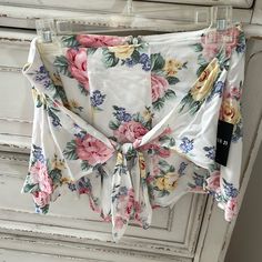 Cute White Floral Shorts From Forever 21 Size Large Has A Zipper On The Back And A Bow/Knot Detail On Front Floral Print Short Bottoms For Brunch, White Summer Shorts For Brunch, Summer Shorts For Beach Season Brunch, White Shorts For Brunch In Spring, Trendy Shorts For Summer Brunch, Trendy White Shorts For Brunch, Summer Bottoms With Tie Waist For Brunch, Summer Style Bottoms With Tie Waist For Brunch, White Floral Print Shorts For Beach Season