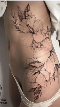 a woman's stomach with flowers on it