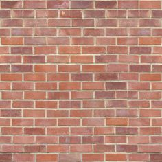 a red brick wall is shown in this image