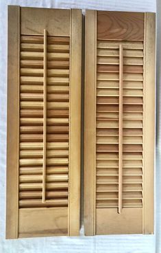 two wooden shutters on top of each other