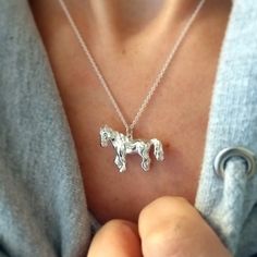 A perfectly shaped little horse pendant, suspended from a fine trace chain. Horses symbolise freedom, travel, movement, and desire. The horse also represents power in Native American tribes. This horse pendant comes on a 1.2mm trace chain which can be worn at 16 or 18 inch length. If you prefer a longer 20/22 inch chain, please add a comment to your order. We can also personalise the pendant with a tiny engraving on the horse's bottom. If you would like us to engrave up to three characters, plea Freedom Travel, Lover Jewelry, Horse Pendant, Free Yourself, Horse Necklace, Engraved Initials, Lovers Necklace, Silver Horse, Sterling Silver Cat