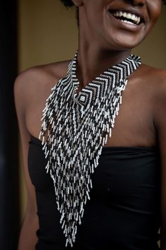 Unique African Maasai Handcrafted Beaded Necklace with an Elegant Look and Brilliant Finish. Color = White, Black and Silver. Length (Around Neck) = Adjustable Width. Length ( Downwards ) = 11 Inches / 28 cm. **GET FREE SHIPPING FOR ADDITIONAL ITEMS PURCHASED. Yes, Buy Multiple Items and pay shipping for 1 item only- The rest ships Free. (No Limits on the number of Multiple items). With a faster delivery time of 3 days via DHLExpress, Worldwide. Ordinary/Standard Shipping also available upon req Bohemian White Jewelry With Black Beads, White Bohemian Necklace With Black Beads, Artisan Beaded Necklace With Black Beads, Bohemian Bib Necklaces For Jewelry Making With Black Beads, Artisan Beaded Necklace With Dangling Beads, Festival Silver Beaded Bib Necklaces, Festival Silver Beaded Bib Necklace, Artisan Beaded Bib Necklace, Bohemian Silver Beads For Party