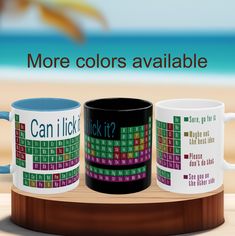 three coffee mugs with the words can i lick it? and more colors available