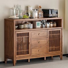 a wooden cabinet with many items on it