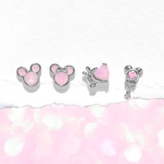 Immerse yourself in the enchanting world of Disney with this adorably dainty four-piece earring set. This set features timeless silhouettes of Mickey Mouse and Minnie Mouse, Mickey's iconic glove embracing a heart, and a captivating Mickey Mouse wand, all elegantly showcased in beautiful shades of pink. This stud set is an absolute must-have for every Disney enthusiast, infusing your everyday style with a touch of magic and whimsy. Experience the magic of Disney with this stud set, designed to c Timeless Silhouettes, Mickey Mouse And Minnie Mouse, World Of Disney, Jewelry Boards, Disney Jewelry, Stud Set, Shades Of Pink, Disney Girls, Jewelry Cleaner