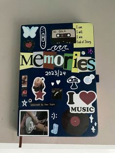 an album with pictures and stickers on it