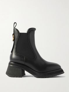 Moncler refreshes the classic Chelsea boots with flared lines and gold-tone logo hardware in this leather 'Gigi' style. Set on 70mm block heels, they have traditional elasticated side panels and substantial rubber-lug soles for reliable grip in any weather. Sweden Clothing, Gigi Style, Moncler Women, Shoes Boots Ankle, Sports Skirts, Black Chelsea Boots, Leather Chelsea Boots, Boot Pumps, Summer Hats