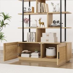 an open book shelf with books and other items on it in front of a white wall