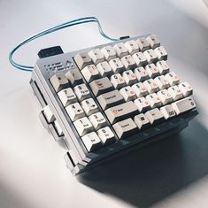 a computer keyboard sitting on top of a table