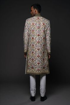 Ivory long sherwani with all over floral garden embroidery using resham thread in multi color tones. - Aza Fashions White Bollywood Sherwani With Floral Embroidery, Designer Sherwani With Floral Embroidery, White Bandhgala With Floral Embroidery For Festivals, White Sherwani With Floral Embroidery For Eid, White Nehru Jacket With Floral Embroidery In Traditional Drape, White Nehru Jacket With Floral Embroidery, Designer Sherwani With Floral Embroidery For Reception, Traditional White Bandhgala With Floral Embroidery, White Floral Embroidered Traditional Bandhgala