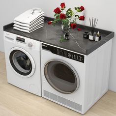 a washer and dryer sitting next to each other on top of a counter