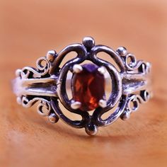 Size 6.25, vintage Sterling 925 silver filigree ring with oval ruby, stamped 925 Vintage Silver Ruby Ring With Intricate Design, Oval Ruby Filigree Vintage Ring, Ornate Oval Ruby Ring With Filigree, Ornate Oval Ruby Ring With Intricate Design, Vintage Oval Garnet Birthstone Ring, Classic Oval Filigree Ring Stamped 925, Vintage Ruby Ring Stamped 925 For Formal Occasions, Classic Oval Sterling Silver Filigree Ring, Ornate Oval Filigree Ring Stamped 925