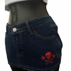 Dark denim color drop waist mini skirt with red glitter skull and star, lips and skull design.  68% Cotton, 16% Polyester, 14% Viscose.  The Christmas delivery cutoff date was Nov. 28th, after that I cannot guarantee arrival by Christmas. There can be slight difference in size of design by 1-3 inches. New skirt design since May 2024 as a result of customer feedback that the original skirt was too short. Please look at the size guide in the last slide, this is a MINI SKIRT so it will be short and you will likely want to wear microshorts underneath. Grunge Mini-length Bottoms For Streetwear, Fitted Grunge Mini Skirt For Streetwear, Rock Style Fitted Skirt For Streetwear, Y2k Festival Mini Skirt, Rock Style Red Mini Skirt, Y2k Mini Skirt For Festivals, Grunge Mini Denim Skirt For Streetwear, Red Rock Mini Skirt, Fitted Emo Mini Skirt For Summer