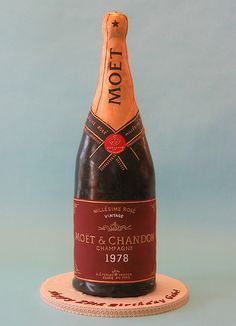 a bottle of wine sitting on top of a coaster that says mott and chandon