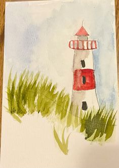 a watercolor painting of a red and white light house in the middle of grass