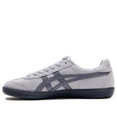 The Onitsuka Tiger Tokuten 'Grey' sneakers are a stylish and comfortable choice for any occasion. Featuring a grey suede upper with a contrasting white leather Tiger stripe, these iconic sneakers offer a timeless look. The padded footbed and durable rubber outsole provide all-day comfort and support.  Elevate your footwear game with this blend of fashion and functionality from the renowned Japanese sports brand, Onitsuka Tiger. (SNKR) Flat Tennis Shoes, Matching Shoes For Couples, 2022 Shoe, Onitsuka Tiger Women Outfit, Onitsuka Tiger Outfit, Onitsuka Tigers, Onitsuka Tiger Women, Pastel Shoes, Non Slip Shoes