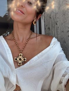 A little bit of glam and a whole lot of style. We know you LOVED the Angelica, so we created a brand new elevated cross necklace plated in 18k gold. This beauty features natural brown stones on a gold plated cross and takes every outfit to the next level. You won’t want to forget the Catania Gold Cross Necklace on your next getaway. Complete the look with your favorite gold jewelry or with the Dani Gold Earrings for a coordinated look we can’t take our eyes off of. **ALL ACCESSORIES ARE FINAL SA Luxury Gold Plated Cross Necklace, Elegant Brass Cross Jewelry, Elegant Brass Cross Pendant Necklace, Elegant Brass Jewelry With Cross Pendant, Gold-tone Gold-plated Cross Jewelry, Gold-tone Cross Shaped Gold Plated Jewelry, Gold-tone Cross-shaped Gold-plated Jewelry, Elegant Brass Cross Pendant Jewelry, Gold-tone Cross-shaped Gold Plated Jewelry